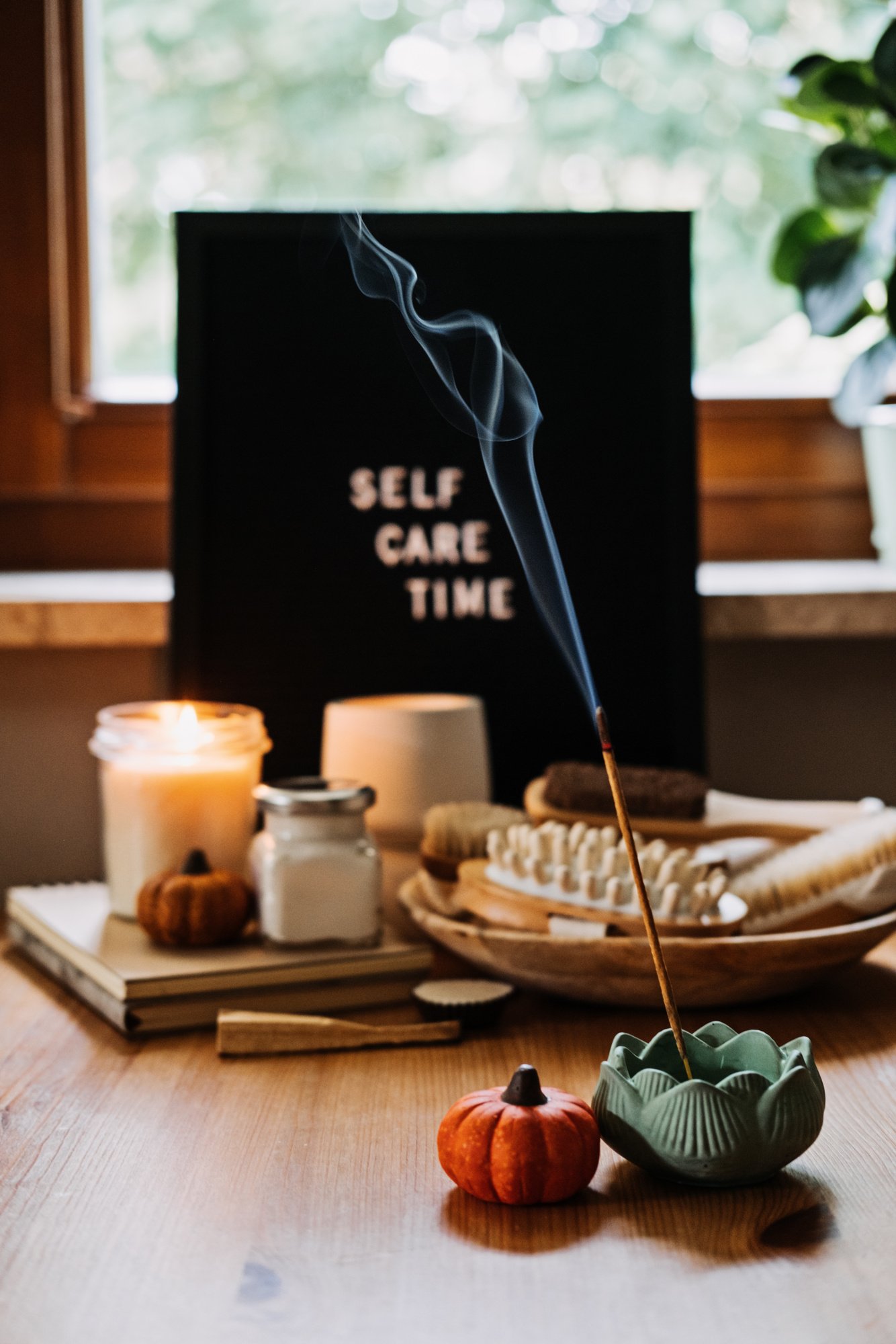 Self-care, Wellness in autumn, winter cold season. Letter board text Self Care Time, aroma sticks, body and self-care handmade cosmetics and beauty product and decor pumpkins